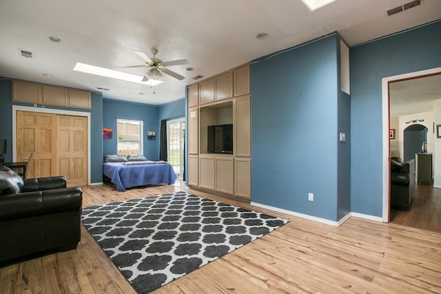 8215 Corona Ave NE, Albuquerque, NM 87122 - bedroom with light wood-style floors, baseboards, and a ceiling fan