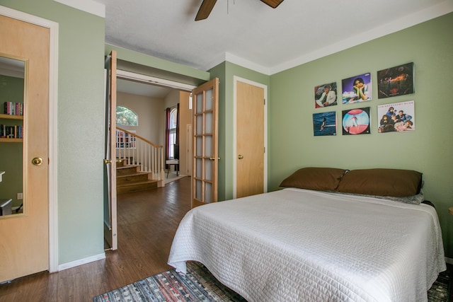 8215 Corona Ave NE, Albuquerque, NM 87122 - bedroom with dark wood finished floors, a ceiling fan, and baseboards