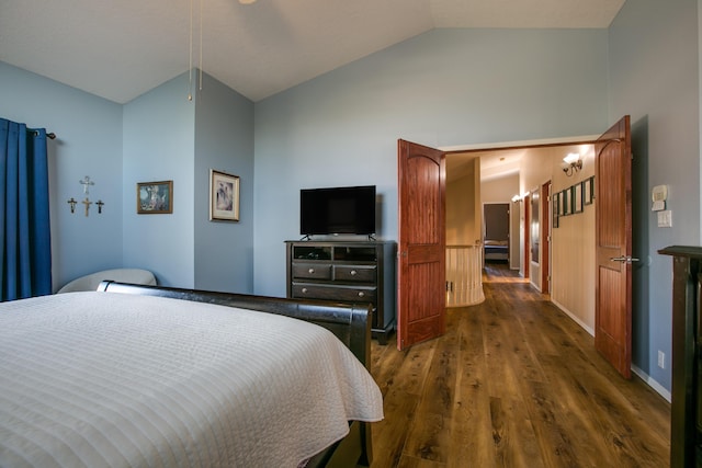 8215 Corona Ave NE, Albuquerque, NM 87122 - bedroom with vaulted ceiling and dark wood-type flooring