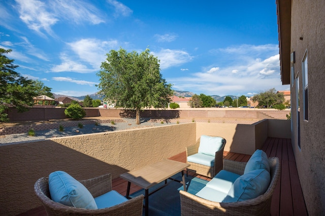 8215 Corona Ave NE, Albuquerque, NM 87122 - fenced backyard featuring a mountain view and a balcony