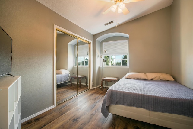8215 Corona Ave NE, Albuquerque, NM 87122 - bedroom with wood finished floors, a closet, baseboards, and a ceiling fan