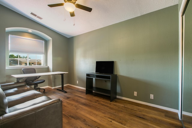 8215 Corona Ave NE, Albuquerque, NM 87122 - living area featuring vaulted ceiling, ceiling fan, wood finished floors, baseboards, and a desk