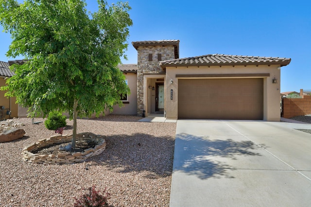 6240 Redroot St, Albuquerque, NM 87120 - mediterranean / spanish house with stucco siding, a tiled roof, a garage, and concrete driveway