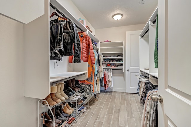 6240 Redroot St, Albuquerque, NM 87120 - spacious closet featuring wood finished floors