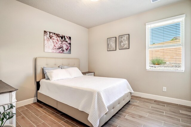 6240 Redroot St, Albuquerque, NM 87120 - bedroom with wood finish floors and baseboards