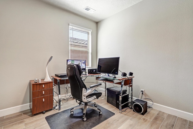 6240 Redroot St, Albuquerque, NM 87120 - office space with wood finished floors, baseboards, and a textured ceiling