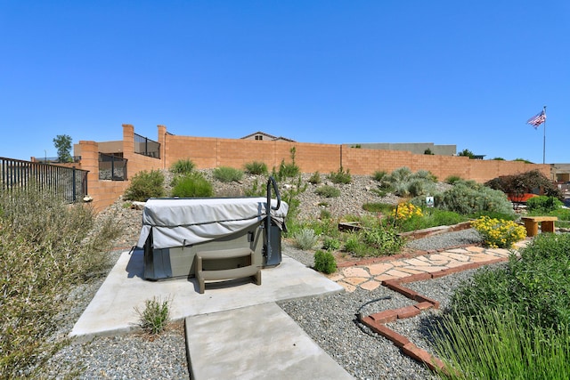 6240 Redroot St, Albuquerque, NM 87120 - fenced backyard with a hot tub and a patio area