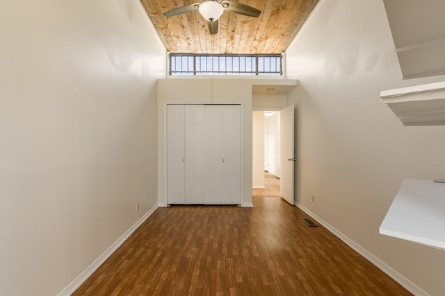 600 Aztec Rd NW, Albuquerque, NM 87107 - unfurnished living room with a high ceiling, ceiling fan, wood finished floors, baseboards, and wood ceiling