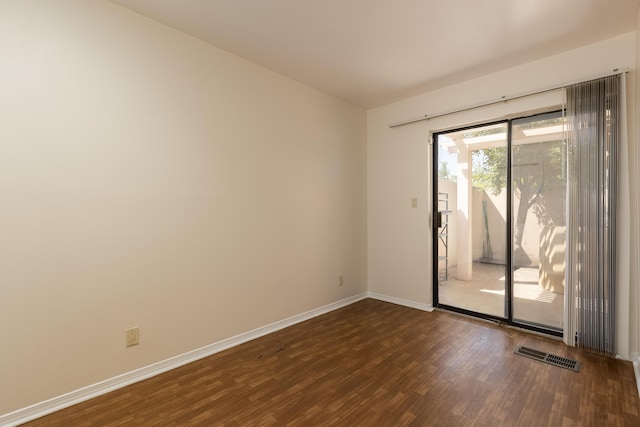 600 Aztec Rd NW, Albuquerque, NM 87107 - spare room featuring wood finished floors and baseboards