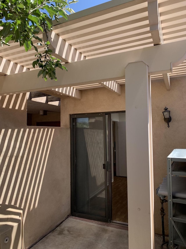 600 Aztec Rd NW, Albuquerque, NM 87107 - doorway to property with stucco siding