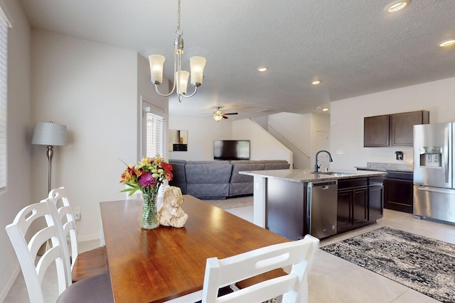 2317 Solara Loop NE, Rio Rancho, NM 87144 - dining room featuring ceiling fan, recessed lighting, a chandelier, a textured ceiling, and light tile patterned flooring