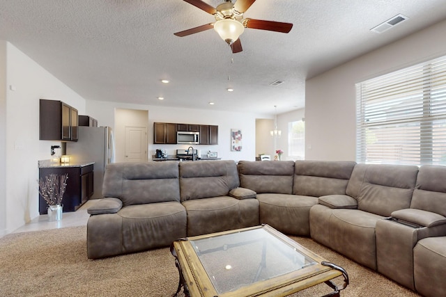 2317 Solara Loop NE, Rio Rancho, NM 87144 - living room with ceiling fan, a textured ceiling, and recessed lighting