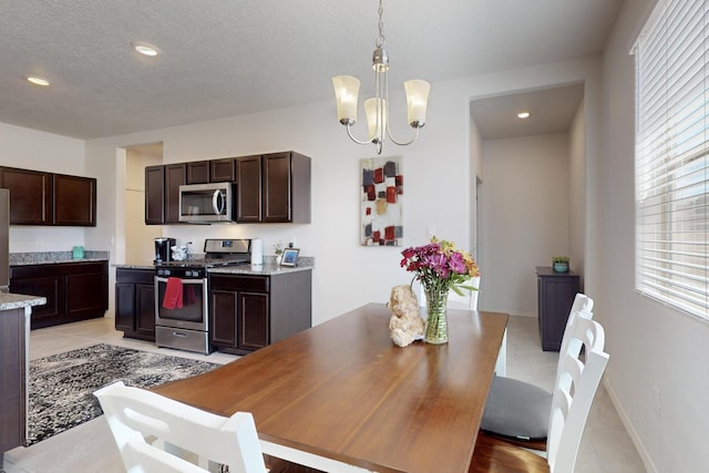 2317 Solara Loop NE, Rio Rancho, NM 87144 - dining room featuring a chandelier, light tile patterned floors, recessed lighting, and a textured ceiling