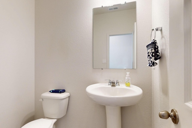 2317 Solara Loop NE, Rio Rancho, NM 87144 - half bath featuring toilet and a sink