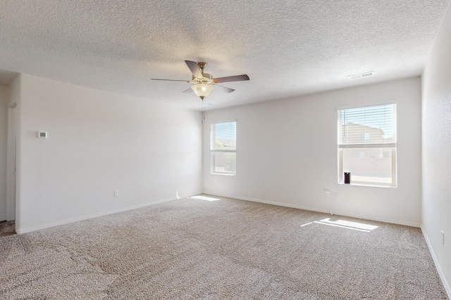 2317 Solara Loop NE, Rio Rancho, NM 87144 - carpeted spare room featuring ceiling fan and a textured ceiling