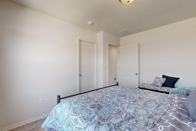 2317 Solara Loop NE, Rio Rancho, NM 87144 - bedroom with carpet floors and a textured ceiling