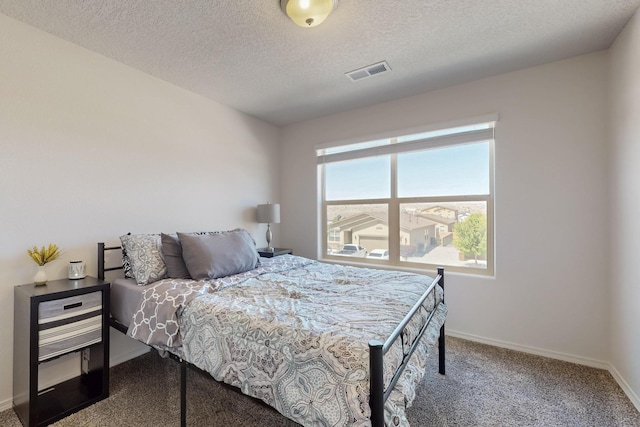 2317 Solara Loop NE, Rio Rancho, NM 87144 - bedroom with carpet flooring and a textured ceiling