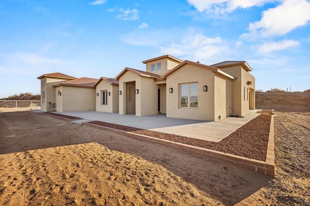 11 Del Cerro Ct, Los Lunas, NM 87031 - view of front of house with a patio area and stucco siding