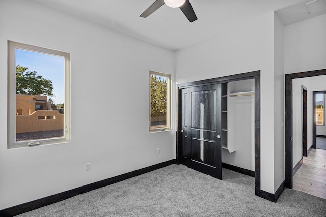 11 Del Cerro Ct, Los Lunas, NM 87031 - unfurnished bedroom with multiple windows, baseboards, carpet floors, and a closet