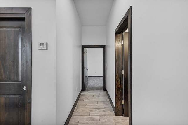 11 Del Cerro Ct, Los Lunas, NM 87031 - corridor featuring light wood-type flooring and baseboards