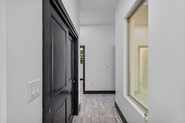 11 Del Cerro Ct, Los Lunas, NM 87031 - hall featuring light wood-type flooring and baseboards