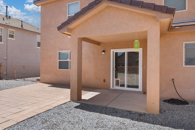 8331 Wild Dunes Ave NW, Albuquerque, NM 87120 - back of property featuring stucco siding and a patio