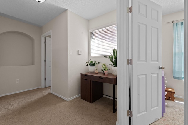 8331 Wild Dunes Ave NW, Albuquerque, NM 87120 - corridor featuring a textured ceiling, carpet floors, and baseboards