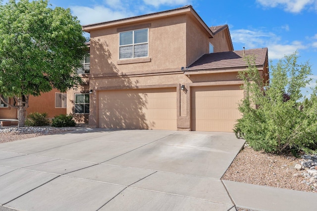 8331 Wild Dunes Ave NW, Albuquerque, NM 87120 - view of front facade with stucco siding, driveway, an attached garage, and a tiled roof