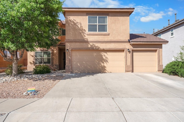 8331 Wild Dunes Ave NW, Albuquerque, NM 87120 - view of front of house featuring stucco siding, driveway, and an attached garage