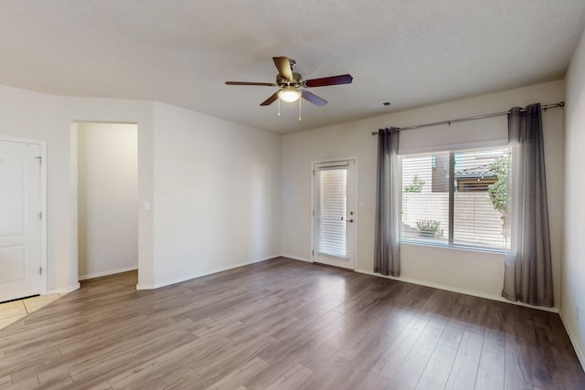 9624 Basalt Peak Dr NW, Albuquerque, NM 87114 - unfurnished room with a ceiling fan, wood finished floors, and baseboards