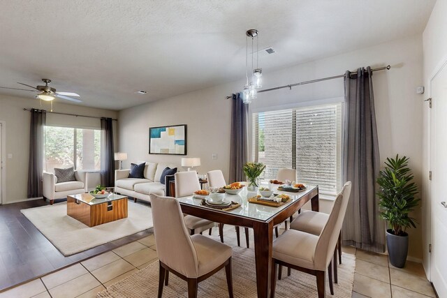 9624 Basalt Peak Dr NW, Albuquerque, NM 87114 - dining space with ceiling fan, light tile patterned floors, and baseboards