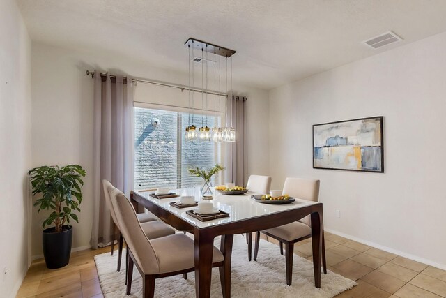 9624 Basalt Peak Dr NW, Albuquerque, NM 87114 - dining space with baseboards and a chandelier