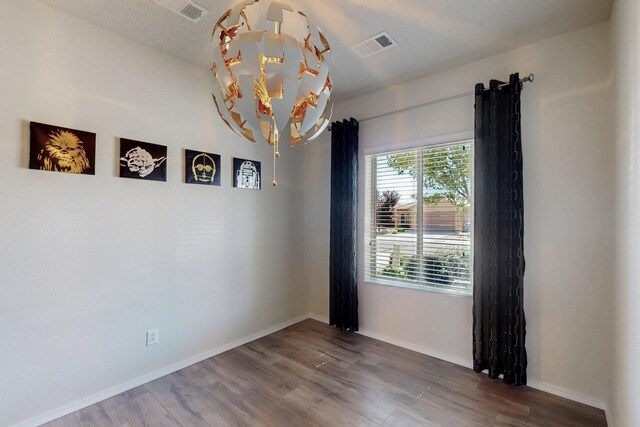 9624 Basalt Peak Dr NW, Albuquerque, NM 87114 - spare room featuring wood finished floors and baseboards