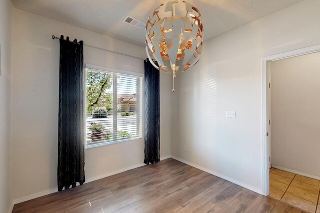 9624 Basalt Peak Dr NW, Albuquerque, NM 87114 - spare room with wood finished floors and baseboards