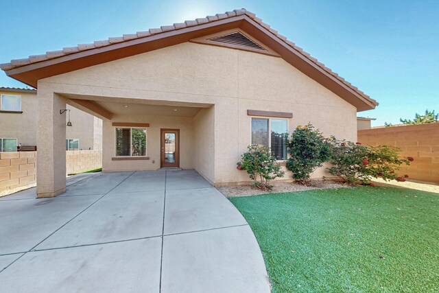 9624 Basalt Peak Dr NW, Albuquerque, NM 87114 - back of house with stucco siding, a patio, and a tiled roof