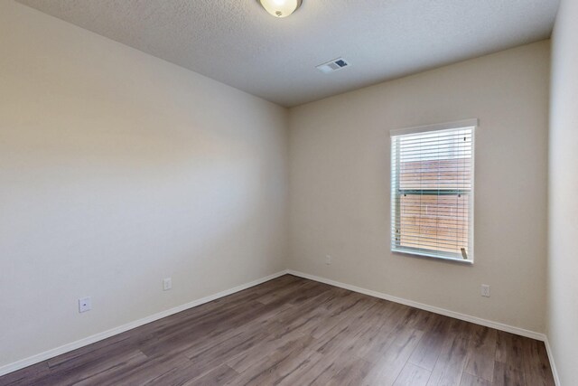 9624 Basalt Peak Dr NW, Albuquerque, NM 87114 - unfurnished room with wood finished floors and baseboards