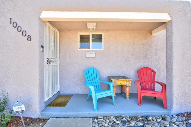10008 Propps St NE, Albuquerque, NM 87112 - property entrance featuring stucco siding