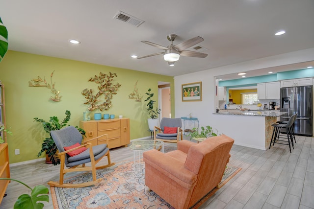 10008 Propps St NE, Albuquerque, NM 87112 - living room with recessed lighting, light wood-type flooring, a ceiling fan, and baseboards