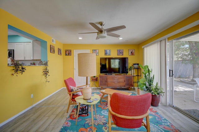 10008 Propps St NE, Albuquerque, NM 87112 - living room with light wood-style flooring, ceiling fan, baseboards, and recessed lighting
