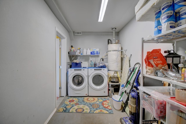 10008 Propps St NE, Albuquerque, NM 87112 - washroom with washer and clothes dryer, secured water heater, and baseboards