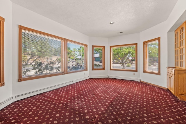 6116 Agate Ave NW, Albuquerque, NM 87120 - unfurnished sunroom featuring carpet, a textured ceiling, and baseboards