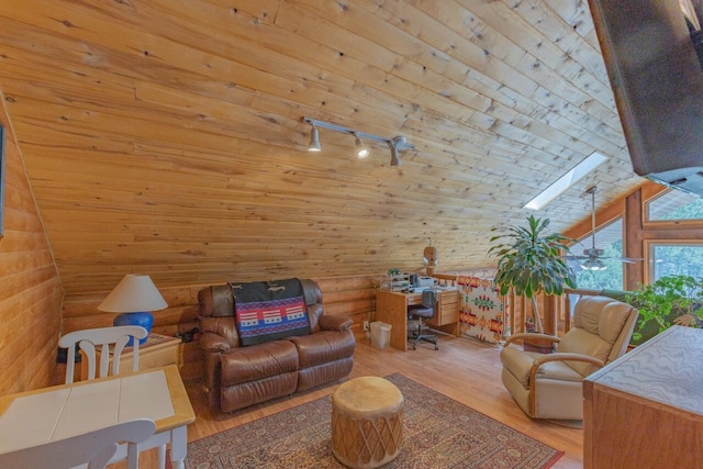 31 Smokey Bear Rd, Ramah, NM 87321 - living room with wood finished floors, rail lighting, a skylight, wood ceiling, and lofted ceiling