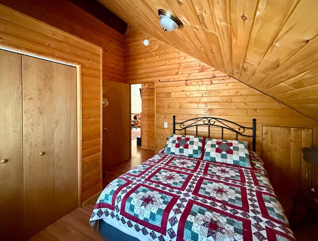 31 Smokey Bear Rd, Ramah, NM 87321 - bedroom featuring wooden ceiling, wood walls, lofted ceiling, and wood finished floors