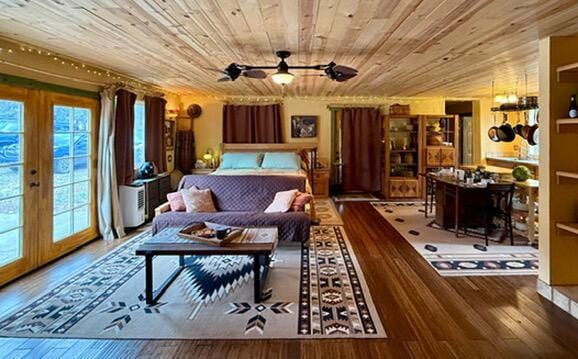 34 Halcon Rd, Ramah, NM 87321 - living area with wood ceiling, wood-type flooring, a ceiling fan, and french doors