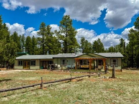 34 Halcon Rd, Ramah, NM 87321 - view of front of home featuring french doors and a front yard