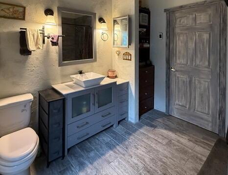 34 Halcon Rd, Ramah, NM 87321 - full bath with vanity, toilet, and wood finished floors