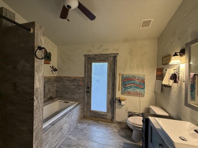 34 Halcon Rd, Ramah, NM 87321 - full bathroom featuring toilet, a textured wall, ceiling fan, vanity, and a bath