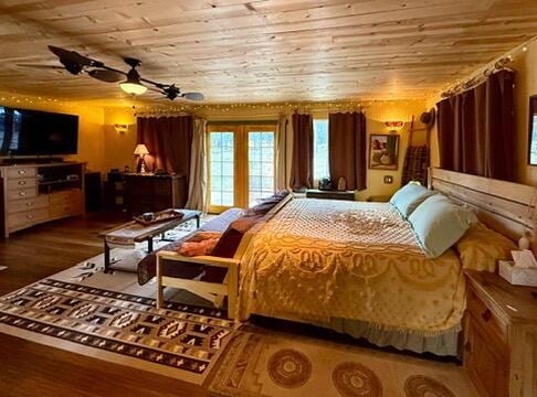 34 Halcon Rd, Ramah, NM 87321 - bedroom featuring wood ceiling and wood finished floors