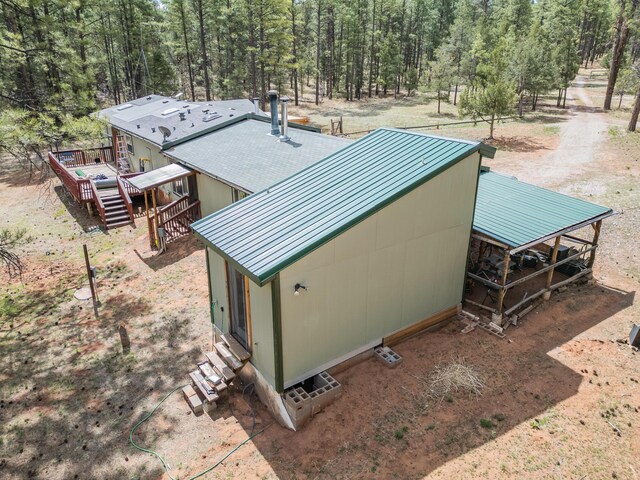 34 Halcon Rd, Ramah, NM 87321 - aerial view of property and surrounding area with a heavily wooded area