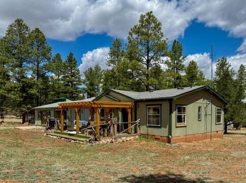 34 Halcon Rd, Ramah, NM 87321 - view of front of house with a front lawn